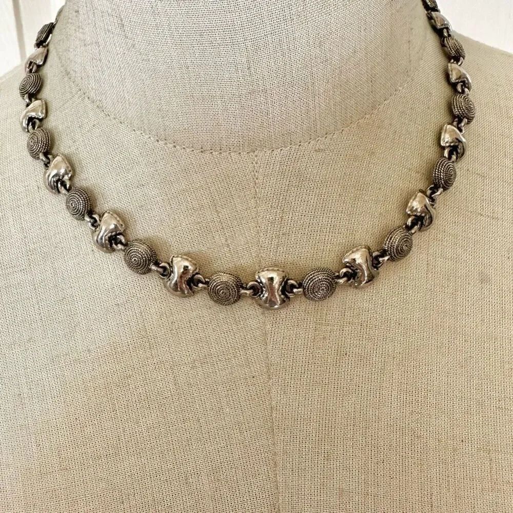 Silver tone circle bow necklace